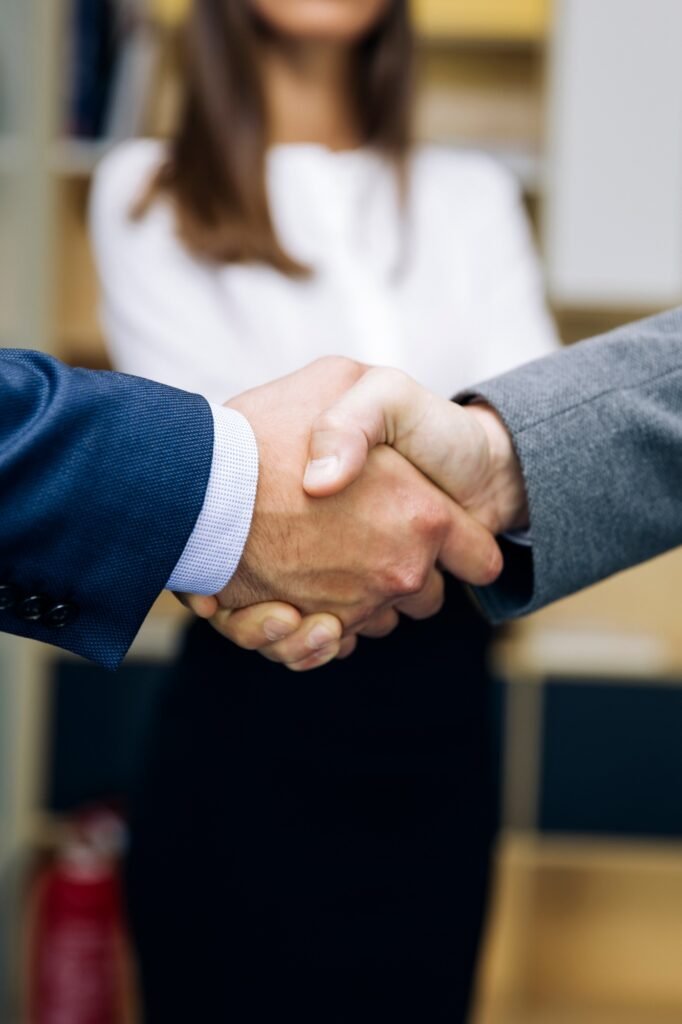 Businessmen handshaking after deal agreement